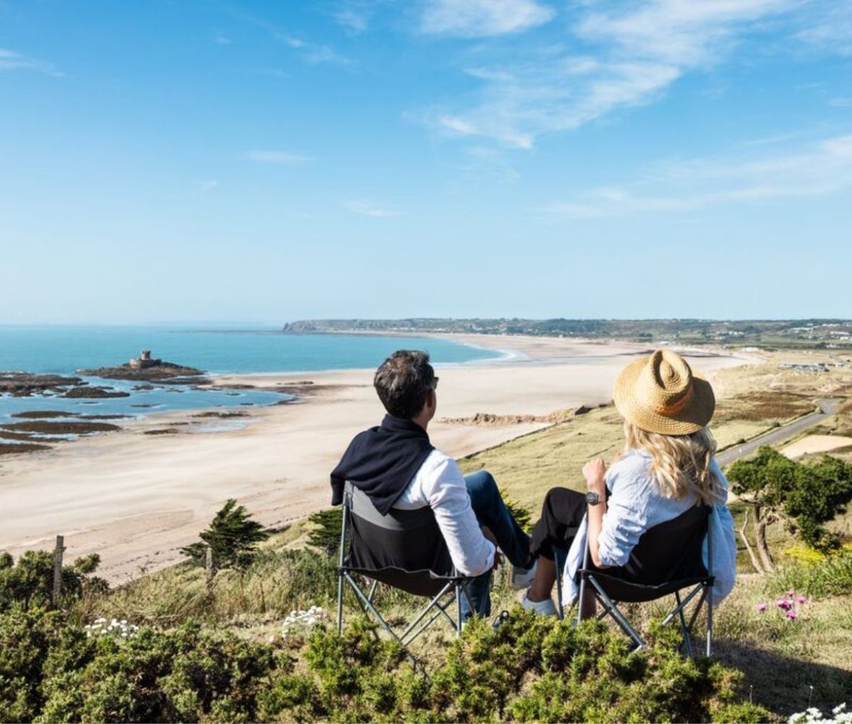 Couple overlooking St. Ouens Bay, Jersey